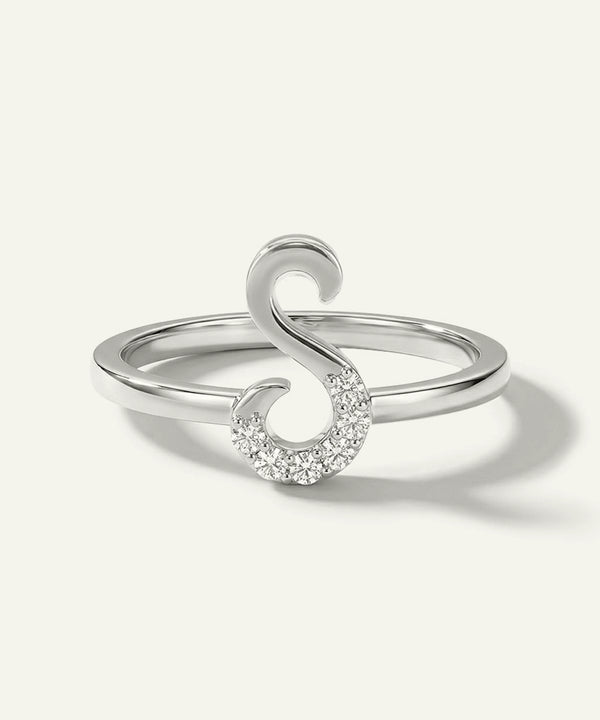 Silver ring with a unique design on a white background