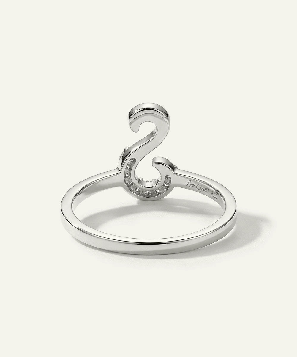 Silver ring with a unique design on a white background
