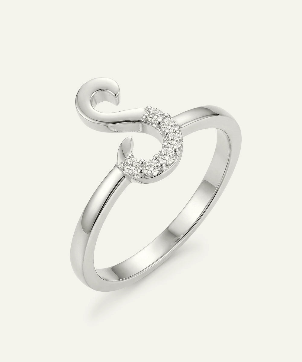 Silver ring with a heart-shaped diamond on a white background