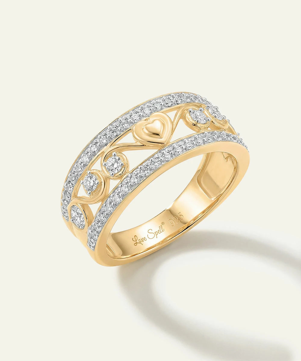Gold ring with diamond accents on a light background
