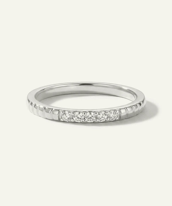 Silver ring with small diamonds on a white background