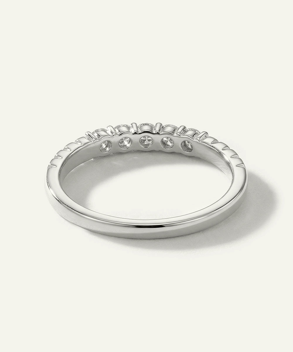 Silver ring with small stones on a white background