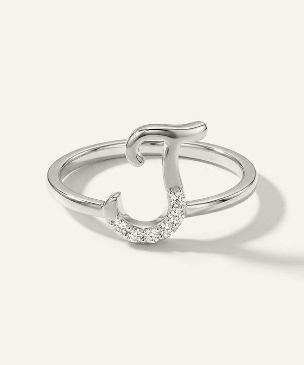 Silver ring with a horseshoe design on a white background