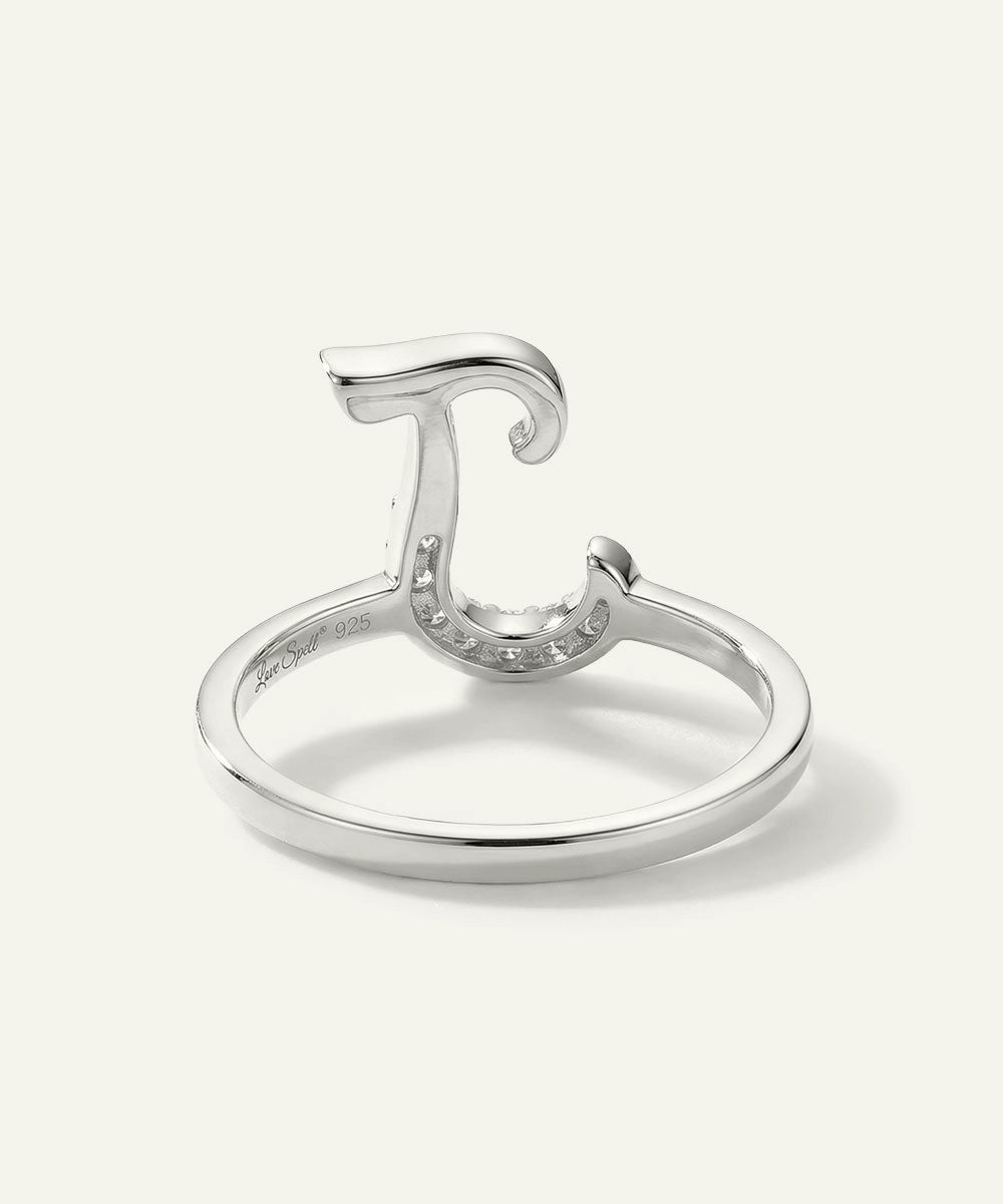 Silver ring with a unique design on a white background