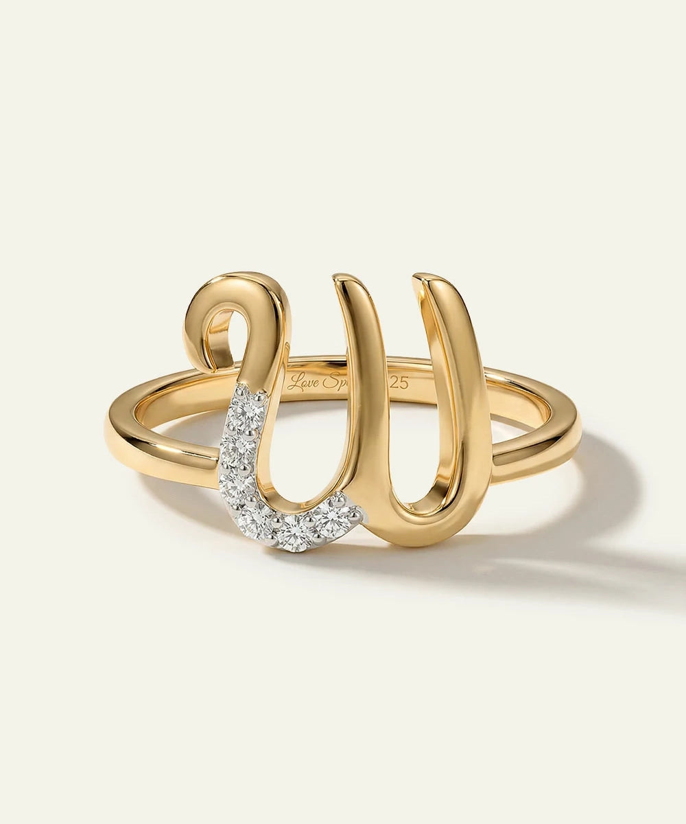 Gold ring with a unique design on a white background