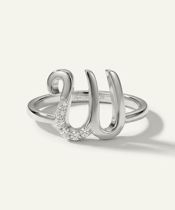 Silver ring with a unique design on a white background