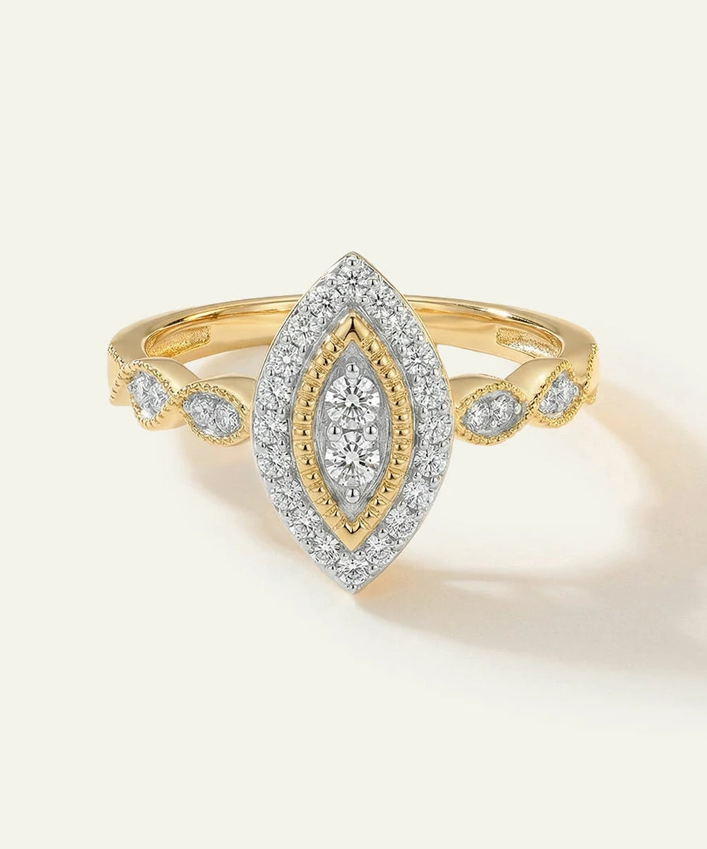 Gold and diamond ring on a light beige background
