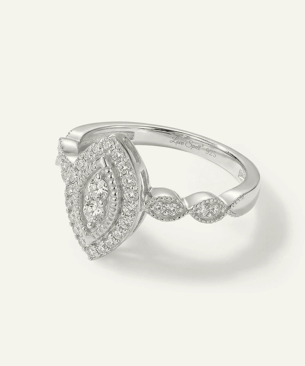 Silver ring with diamond accents on a white background