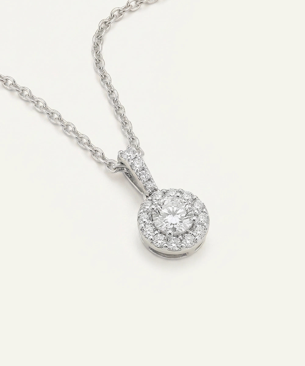 Diamond pendant necklace on a white background