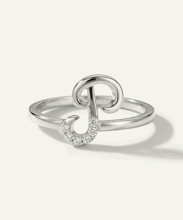 Silver ring with a unique design on a white background