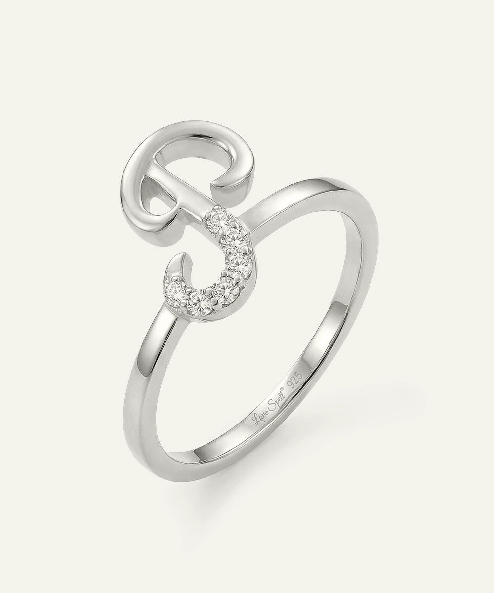 Silver ring with a unique design on a white background