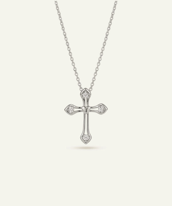 Silver cross necklace with chain on a white background