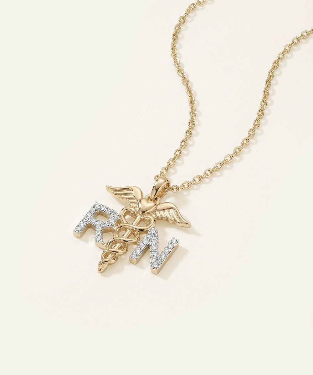 Gold necklace with RN pendant on a white background