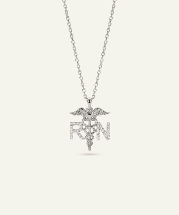 Silver necklace with a caduceus pendant and 'RN' letters on a white background