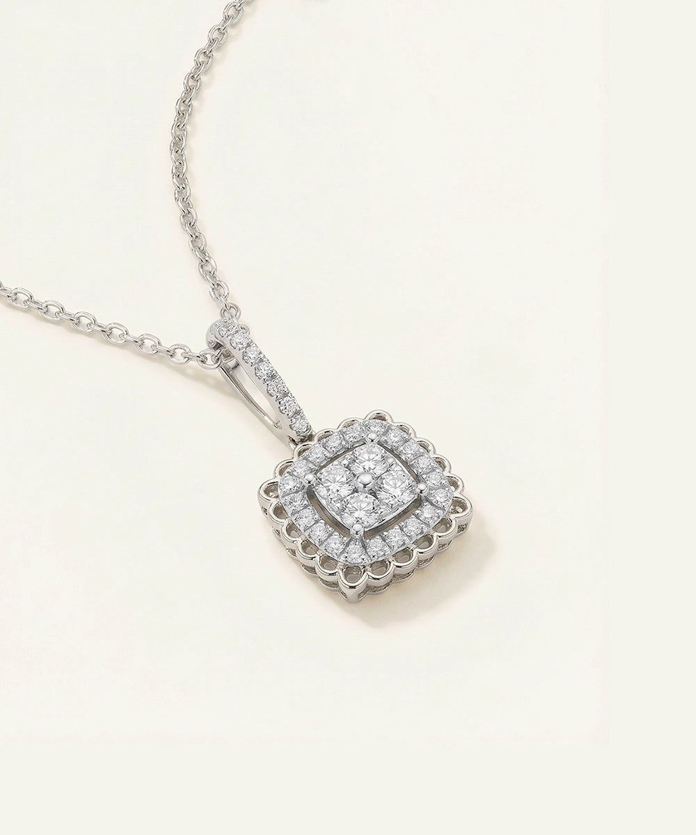 Diamond necklace with a square pendant on a light background