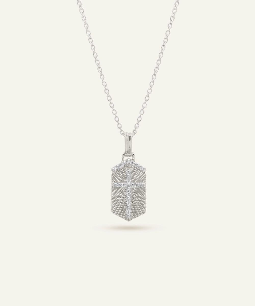 Silver pendant necklace on a light gray background