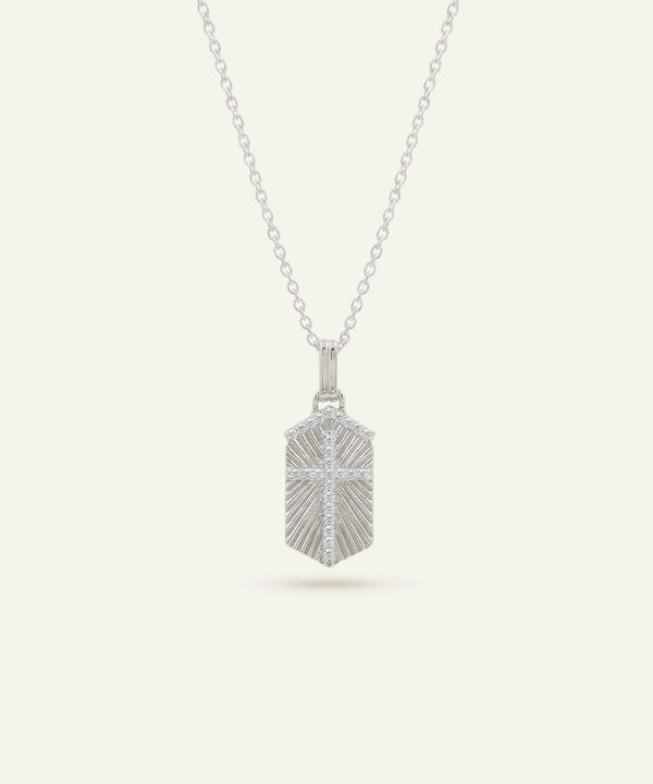 Silver pendant necklace on a light gray background