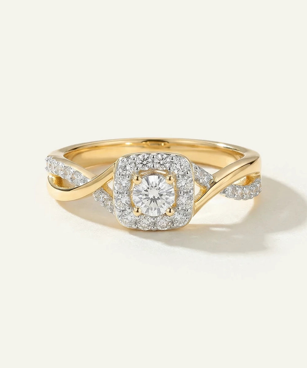 Gold ring with a diamond on a white background