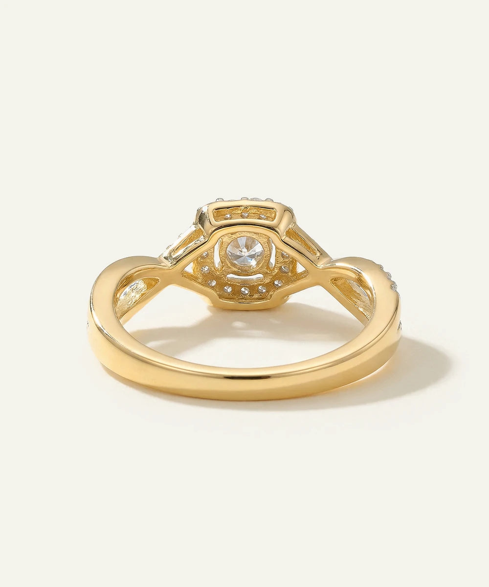 Gold ring with a diamond on a white background