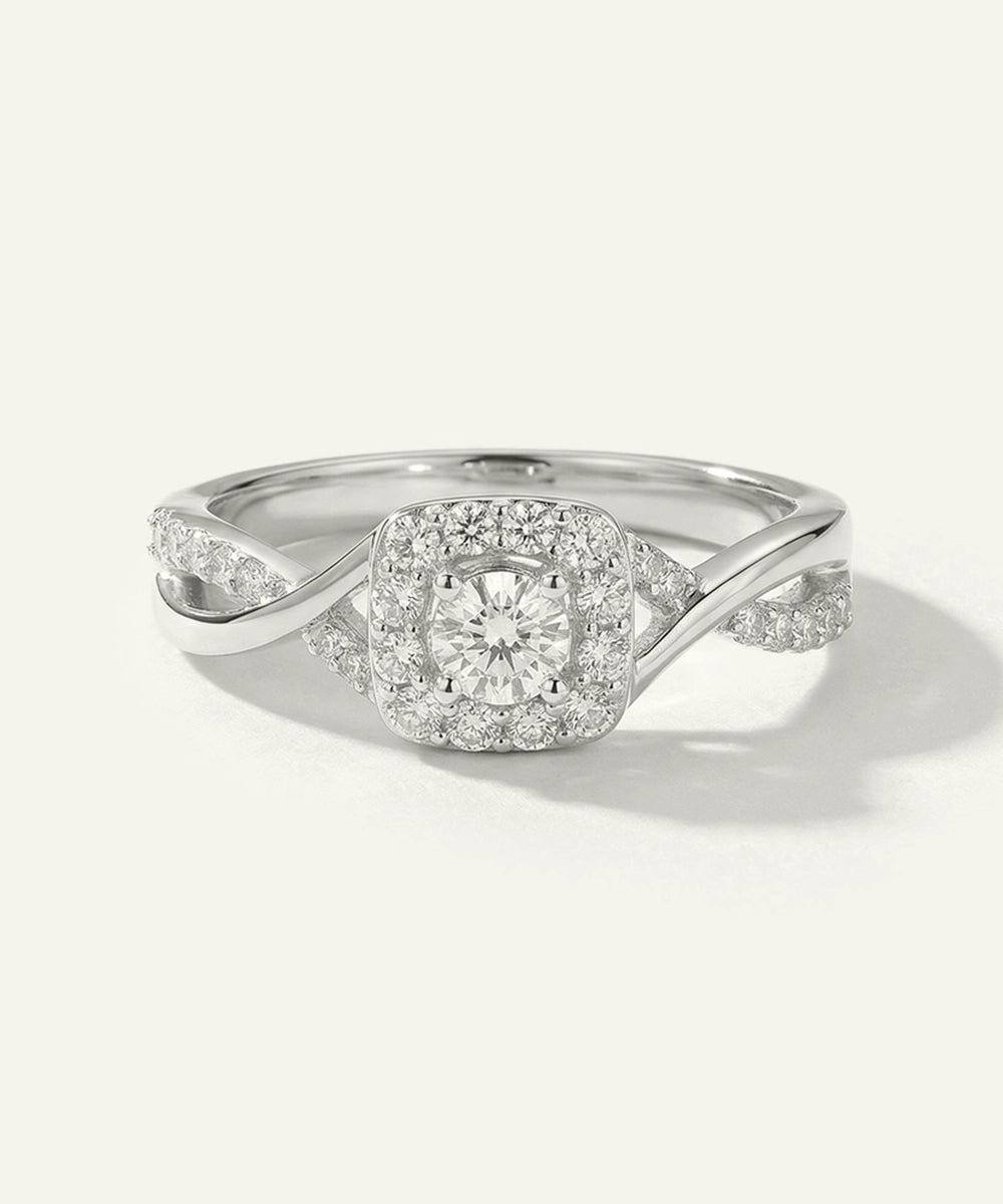Silver ring with diamond accents on a white background