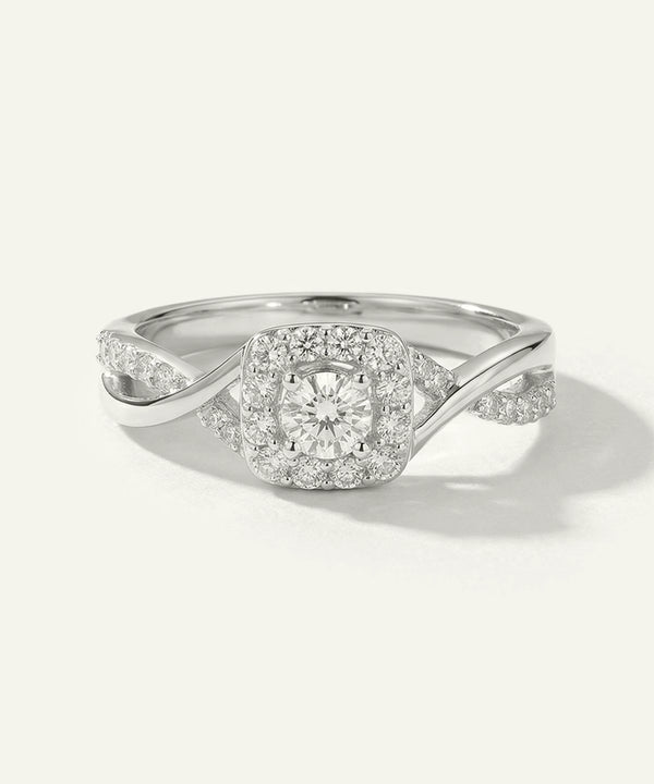 Silver ring with diamond accents on a white background