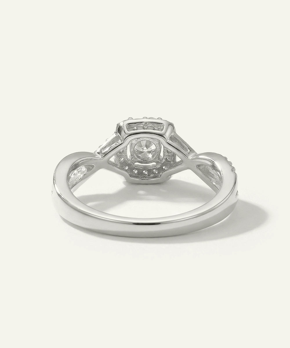 Silver ring with a diamond on a white background