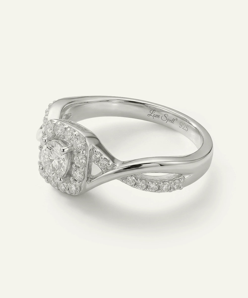 Silver ring with diamond accents on a white background