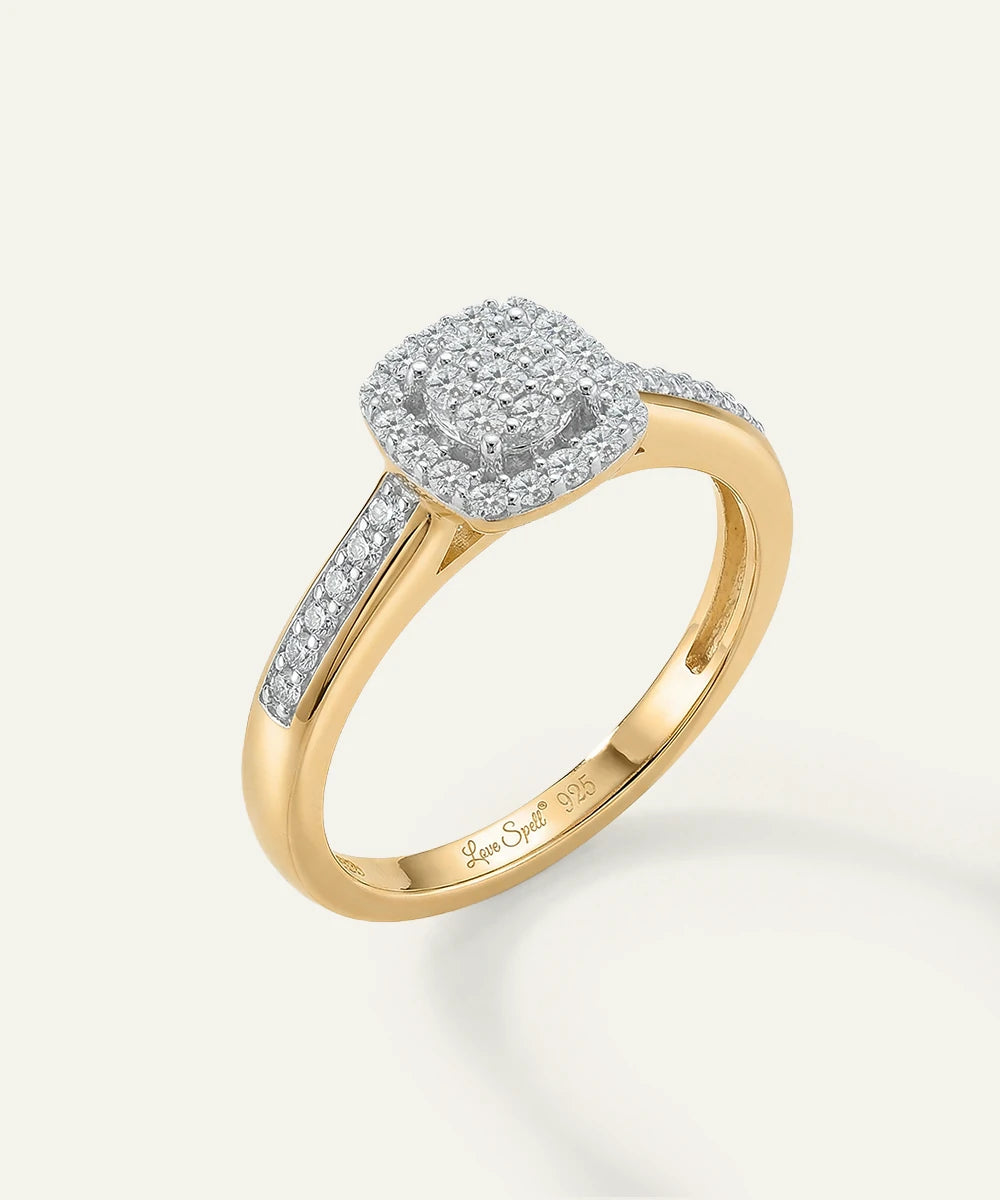 Gold ring with diamond accents on a white background