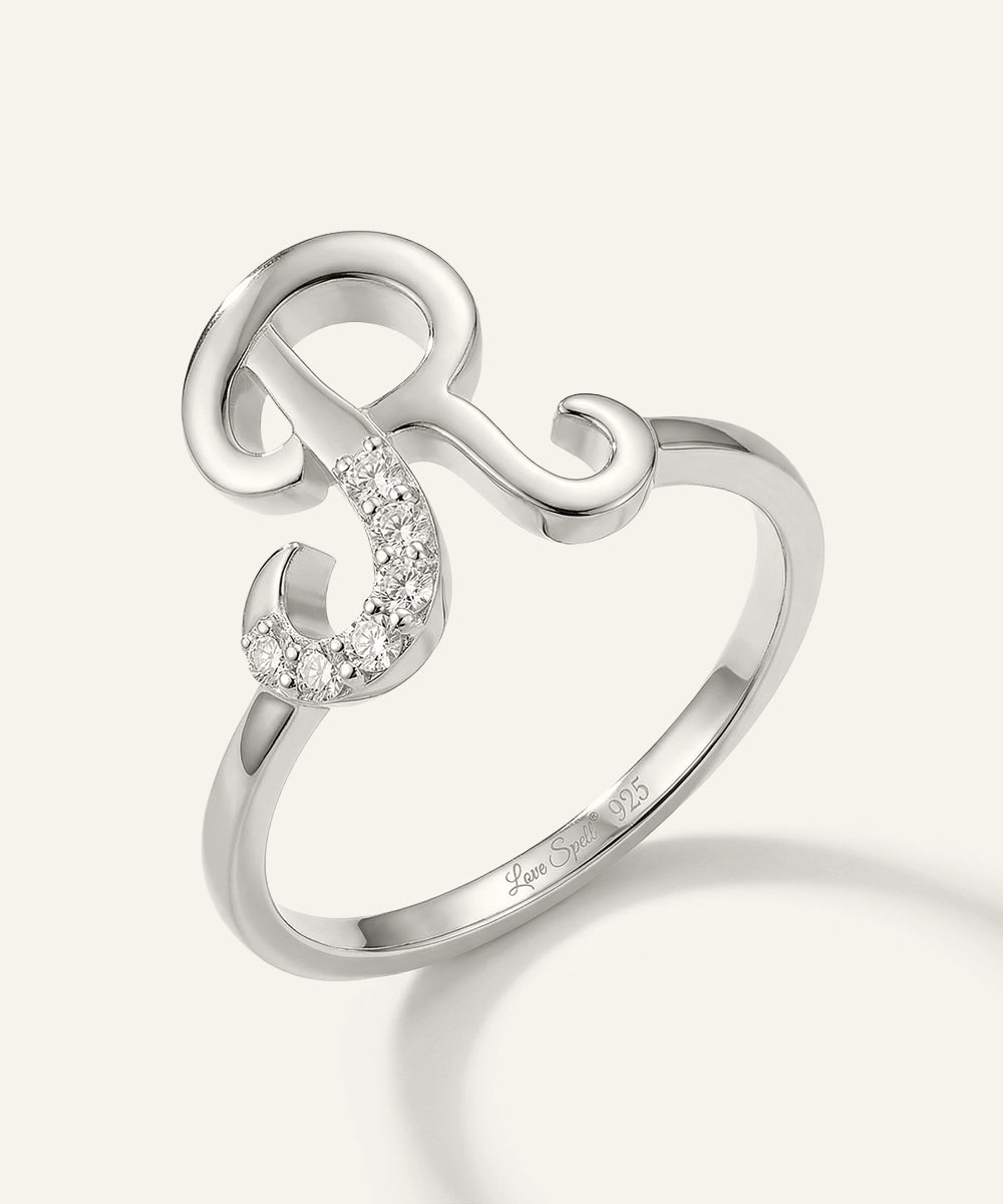 Silver ring with a unique design on a white background