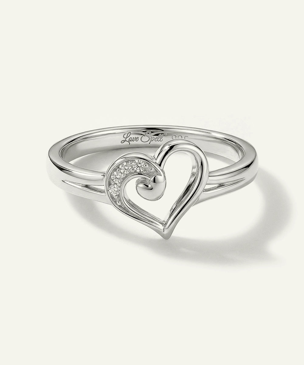 Silver heart-shaped ring on a white background