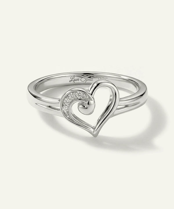 Silver heart-shaped ring on a white background