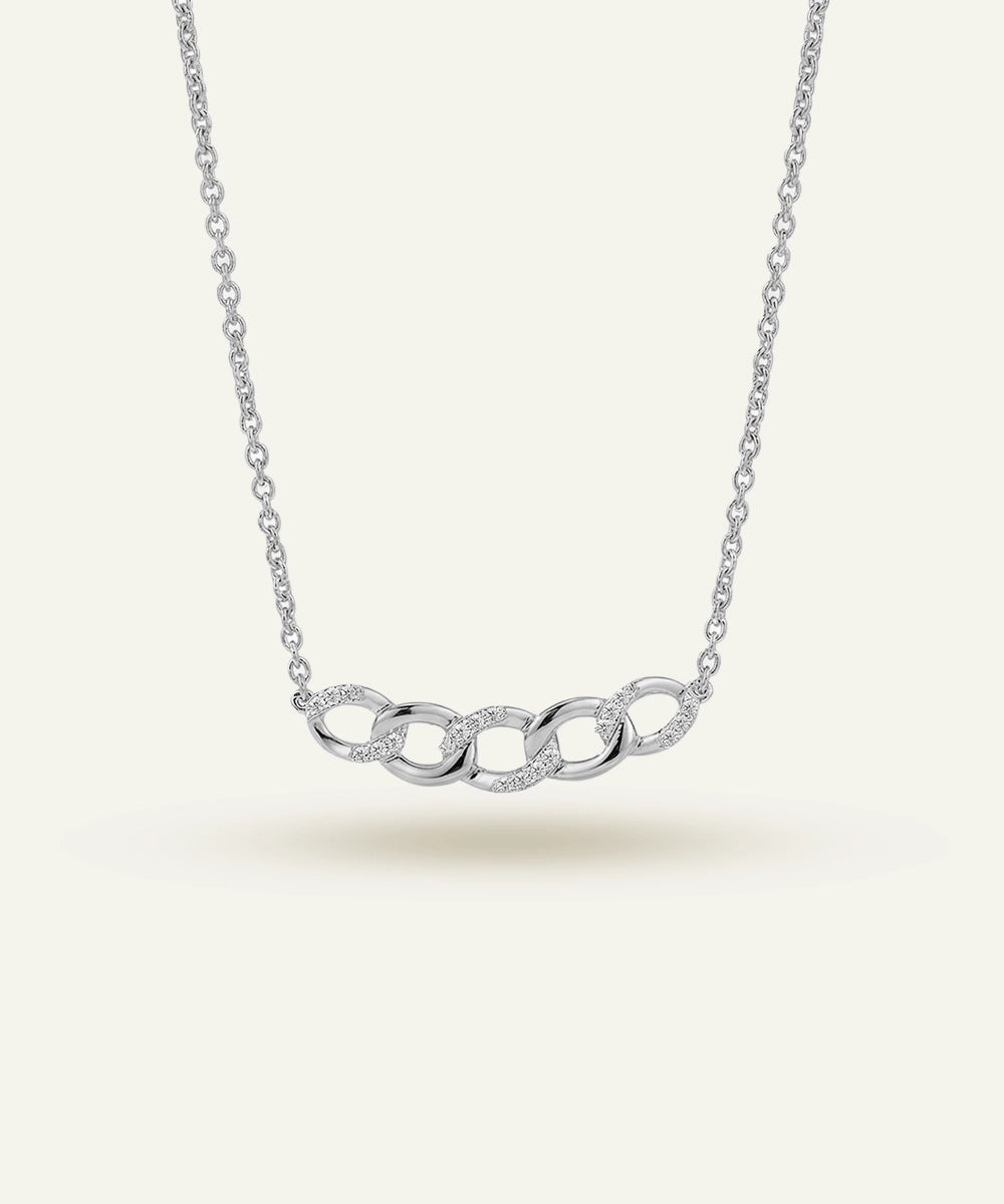 Silver necklace with interlocking rings on a white background