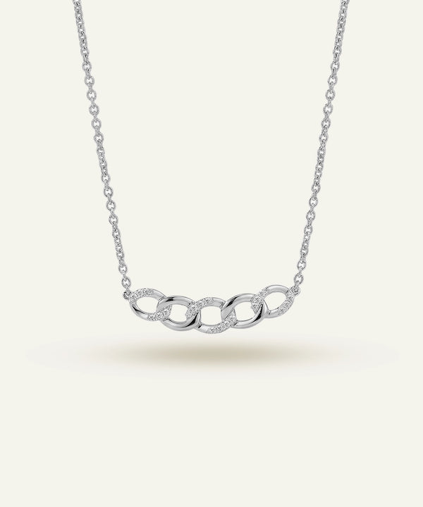 Silver necklace with interlocking rings on a white background