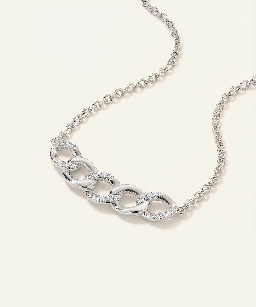 Silver chain necklace on a white background