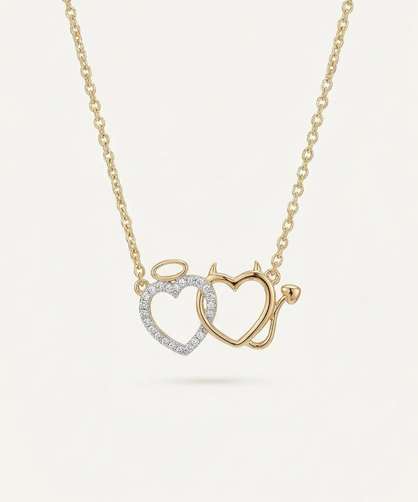 Gold necklace with interlocking heart pendants on a light beige background