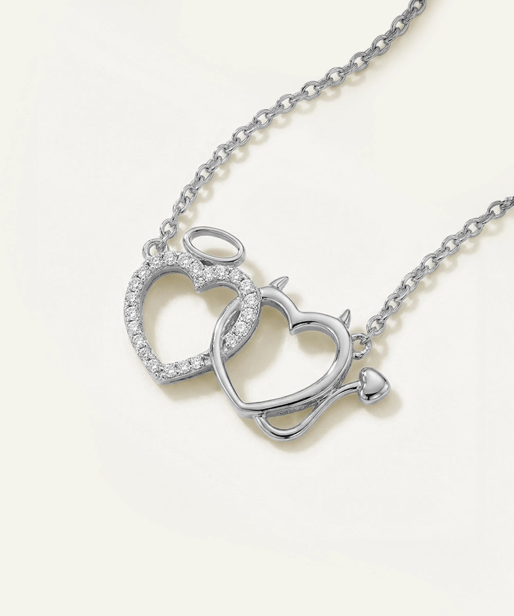 Silver heart-shaped necklace on a white background