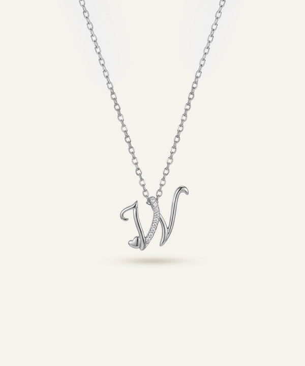 Silver necklace with a 'V' pendant on a light gray background