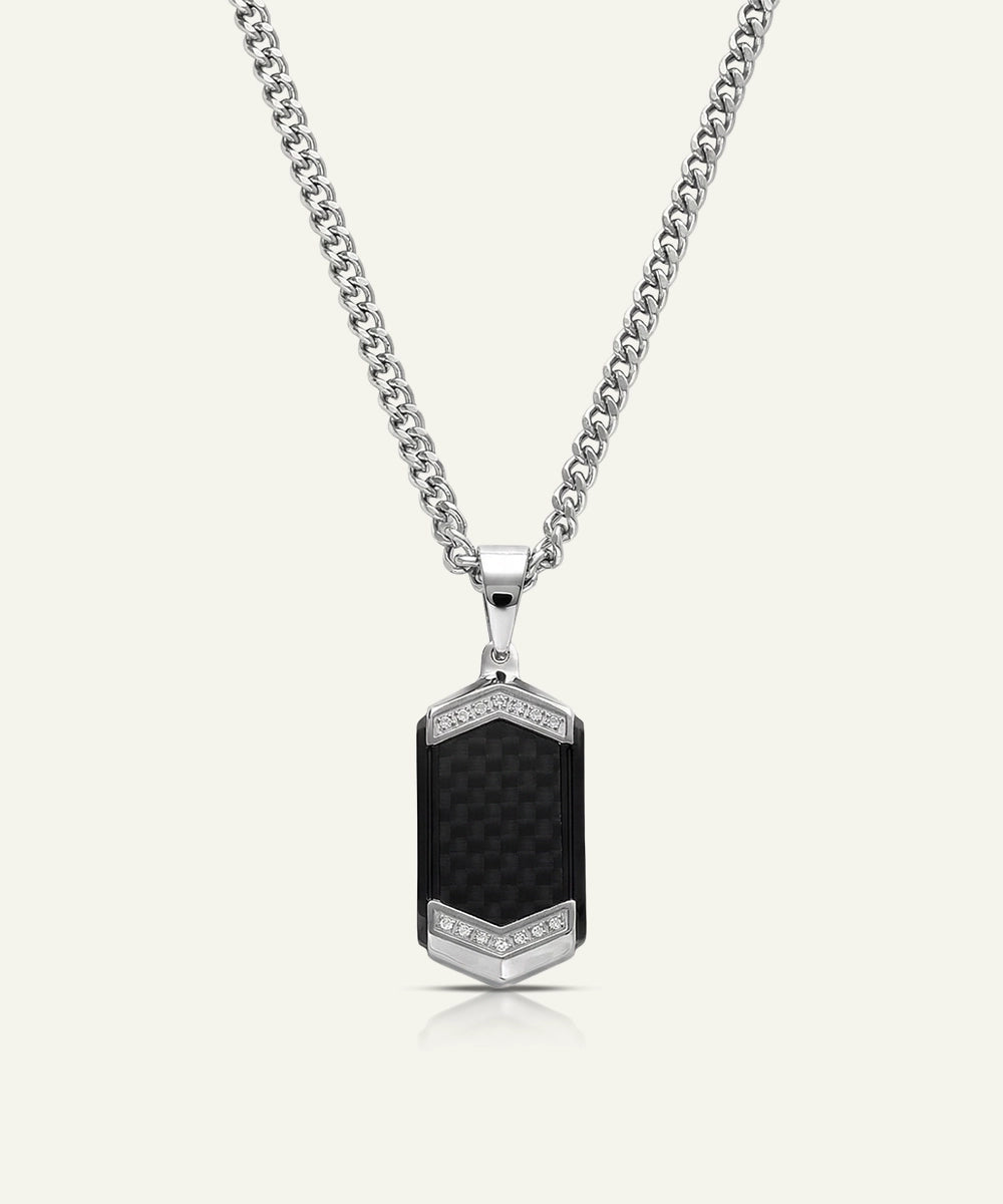 Necklace with a black pendant and silver chain on a white background