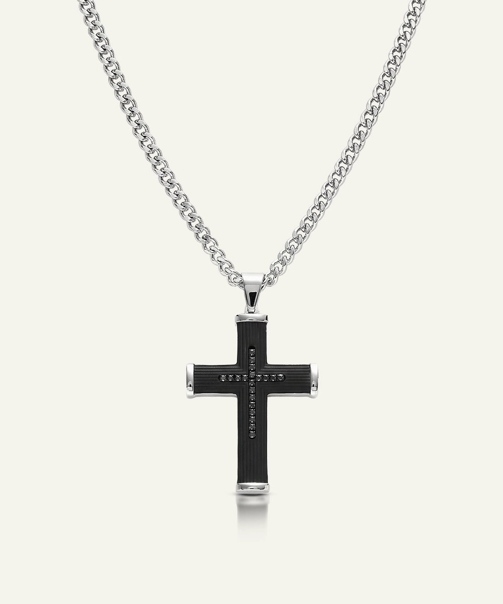 Black cross pendant necklace on a white background