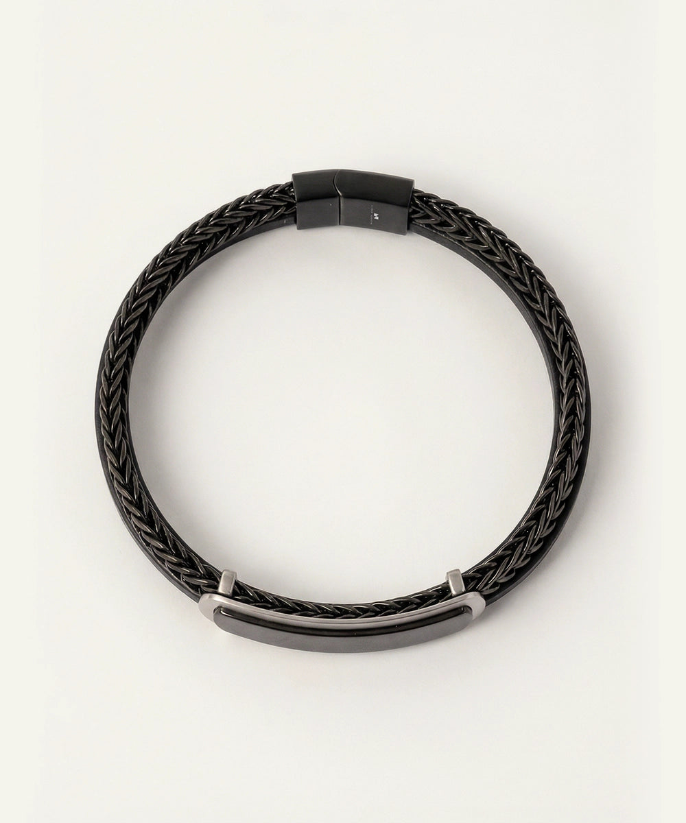 Black braided leather necklace on a white background
