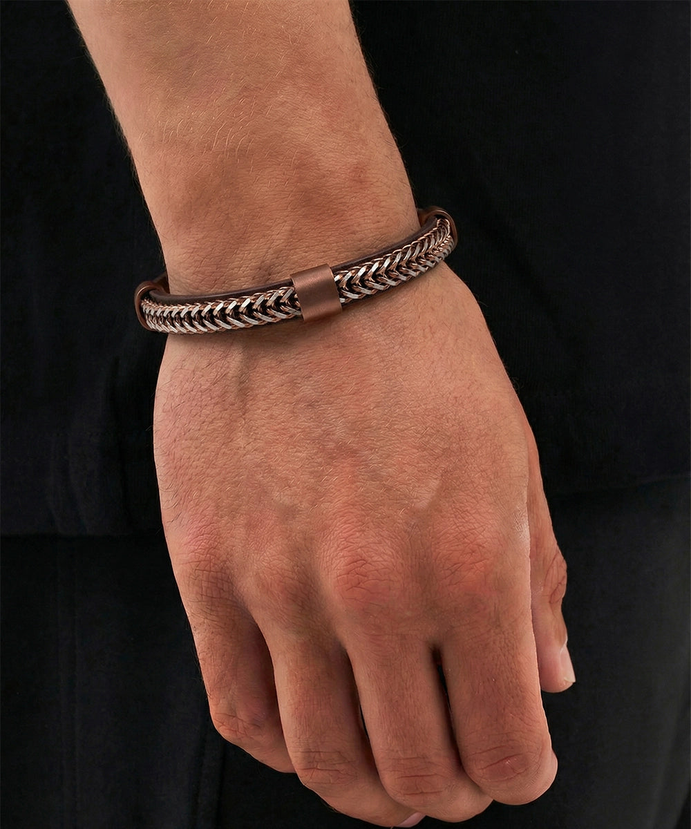 Bracelet on a wrist with a black background