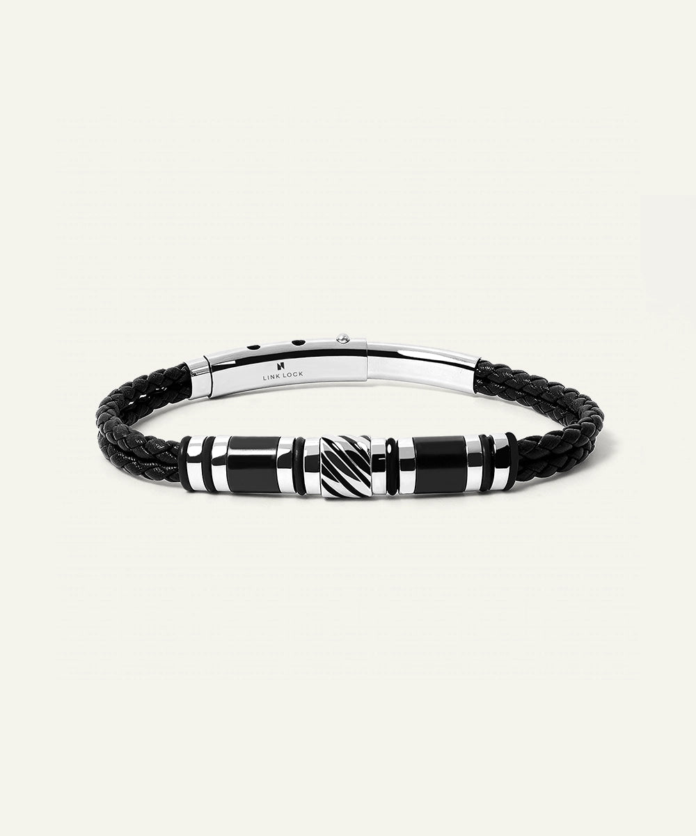 Black braided leather bracelet with a silver clasp on a white background