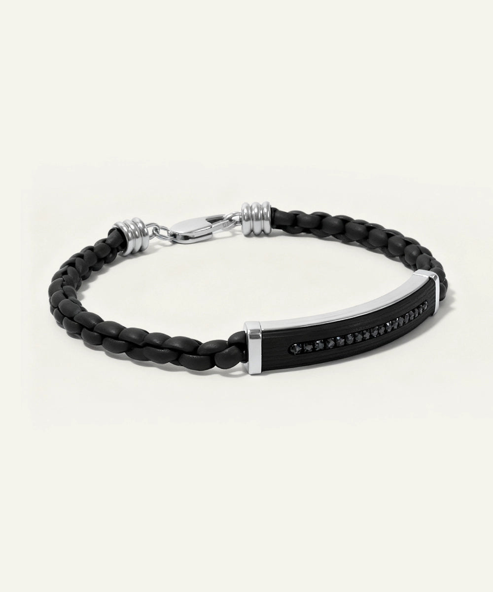 Black braided leather bracelet with silver clasp on a white background