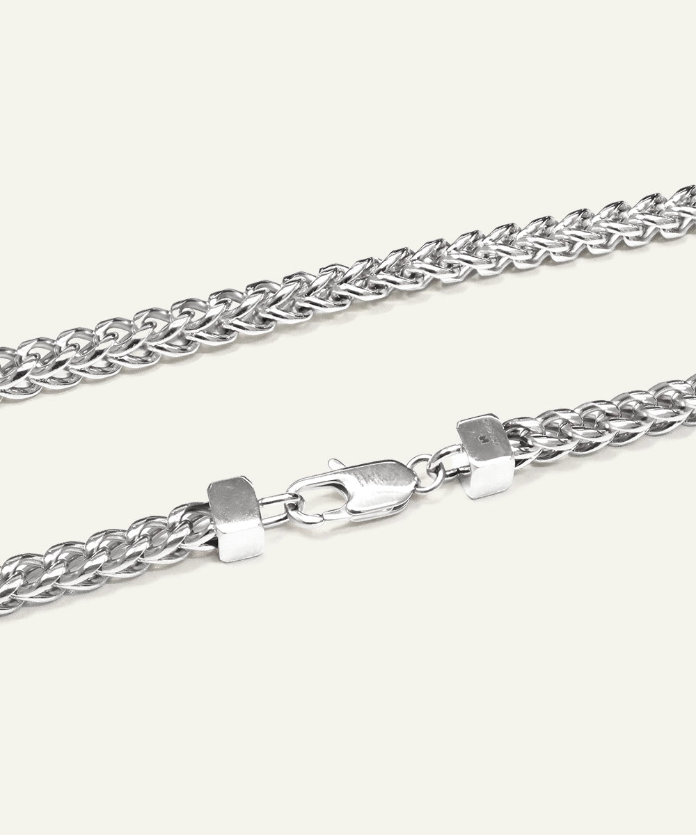 Silver chain necklace with clasp on a white background