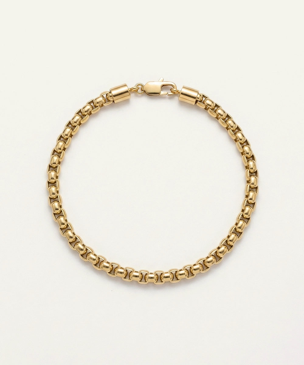 Gold chain bracelet on a white background