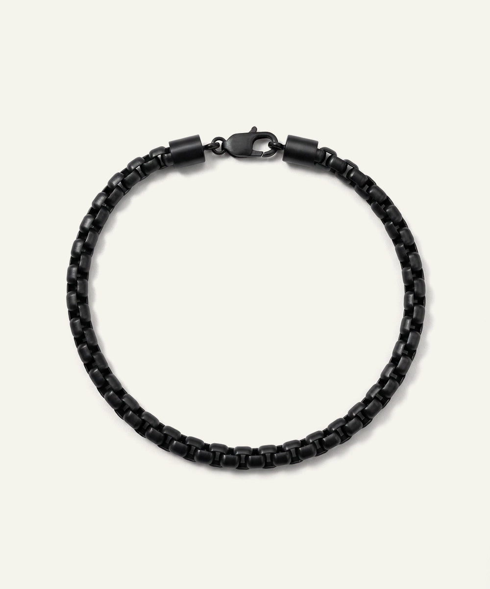 Black beaded bracelet on a white background