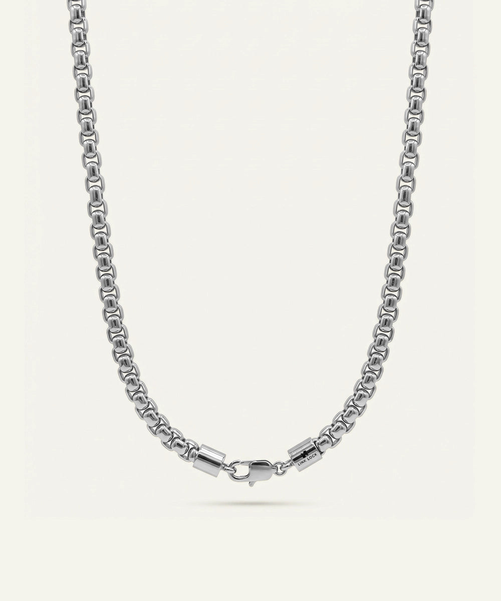 Silver chain necklace on a white background