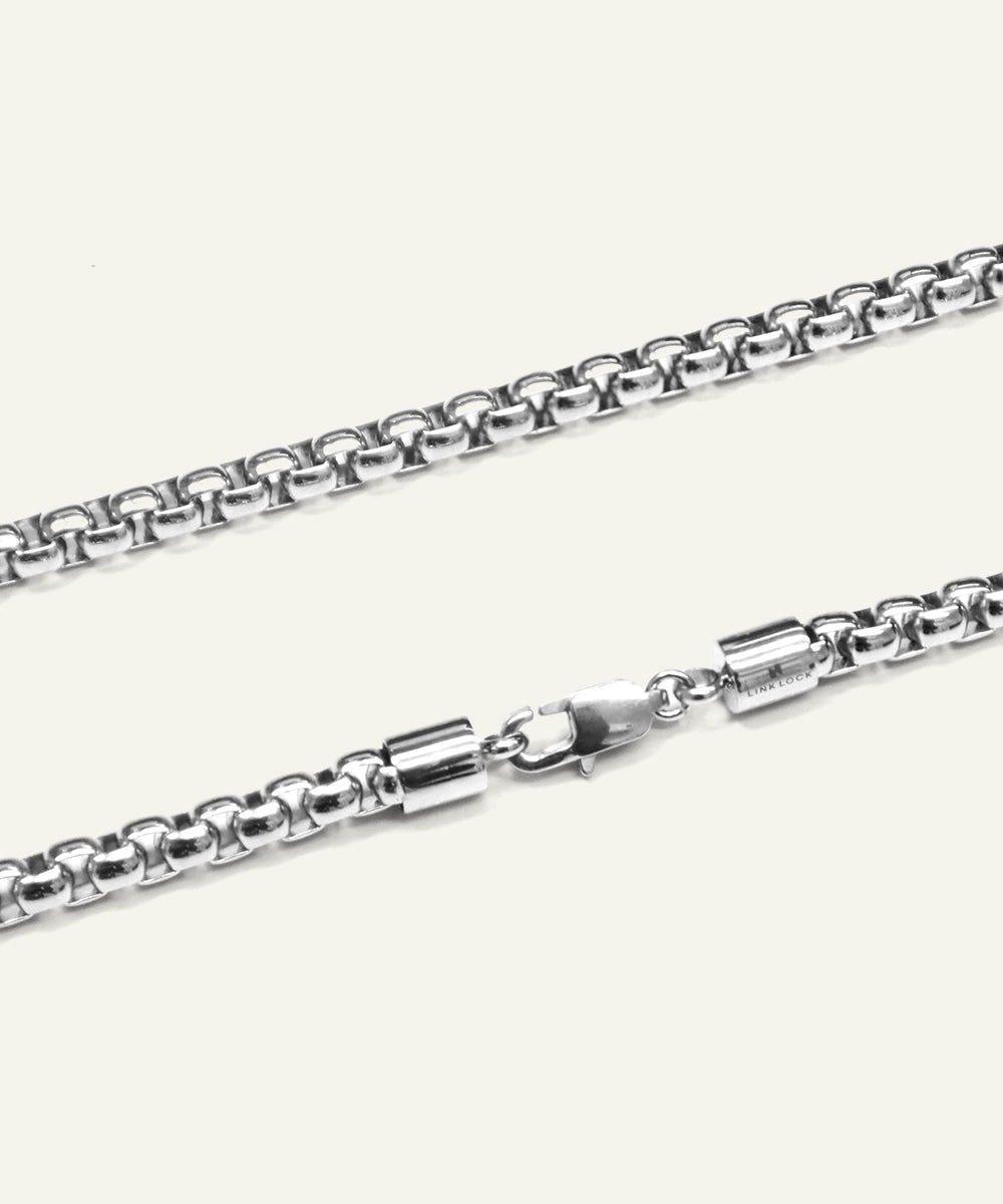 Silver chain necklace on a white background