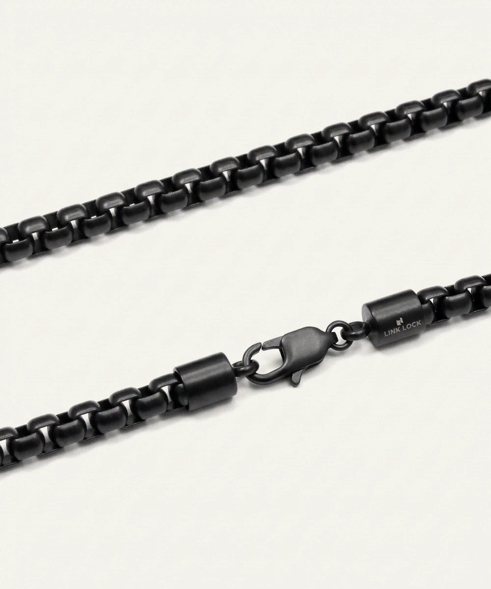 Black chain necklace on a white background