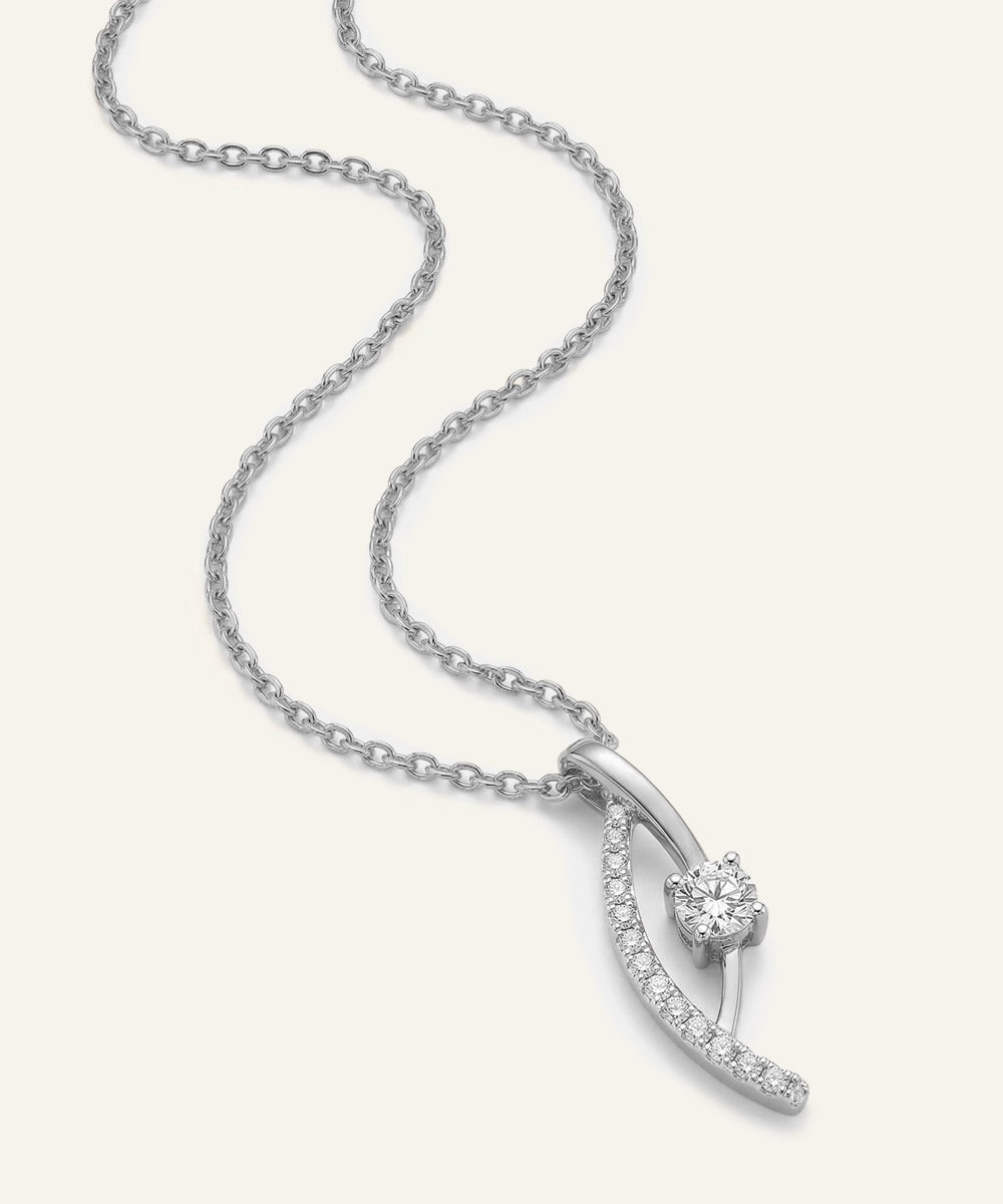 Silver necklace with a diamond pendant on a white background